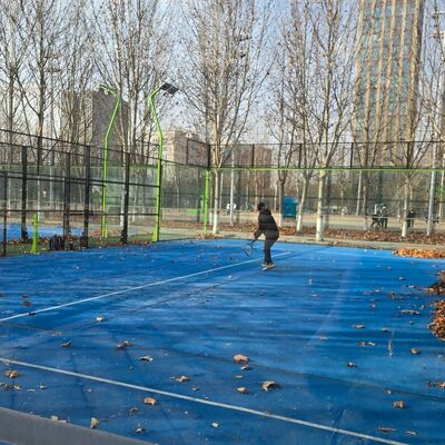 Outdoor Padel Court Equipped With 18 Tempered Glass Panels 50x50mm Mesh Frame IP65 Rated LED Flood Lights For Night Play Capability